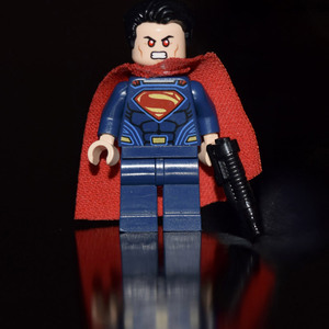 Toy superhero with gun